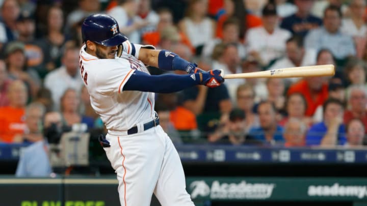 HOUSTON, TX - MAY 19: Carlos Correa #1 of the Houston Astros hits a two-run home run in the sixth inning against the Cleveland Indians at Minute Maid Park on May 19, 2018 in Houston, Texas. (Photo by Bob Levey/Getty Images)