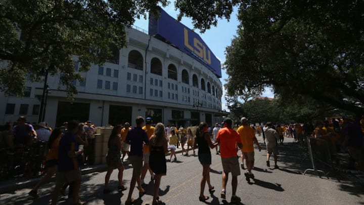 BATON ROUGE, LA - SEPTEMBER 19: Fans walk past Tiger Stadium before a game between the Auburn Tigers and the LSU Tigers on September 19, 2015 in Baton Rouge, Louisiana. (Photo by Ronald Martinez/Getty Images)