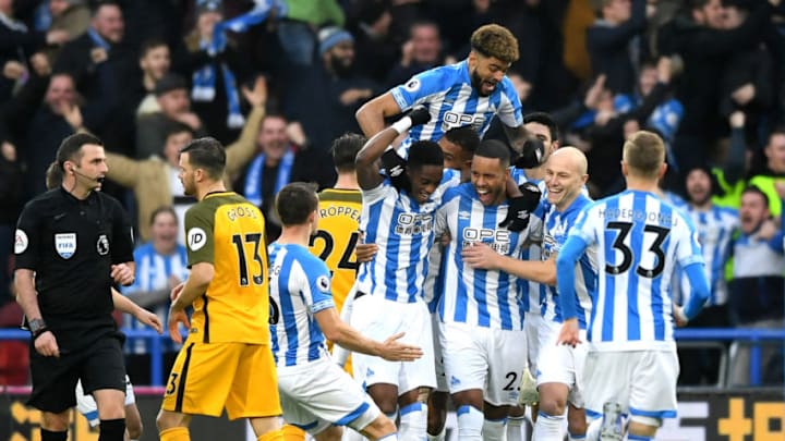 HUDDERSFIELD, ENGLAND - DECEMBER 01: Mathias Zanka Jorgensen of Huddersfield Town celebrates with teammates after scoring his team's first goal during the Premier League match between Huddersfield Town and Brighton & Hove Albion at John Smith's Stadium on December 1, 2018 in Huddersfield, United Kingdom. (Photo by Gareth Copley/Getty Images)