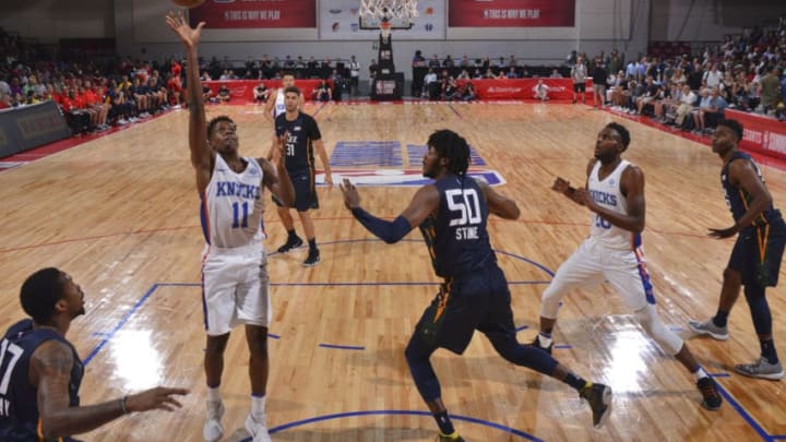 LAS VEGAS, NV - JULY 8: Frank Ntilikina #11 of the New York Knicks shoots the ball against the Utah Jazz during the 2018 Las Vegas Summer League on July 8, 2018 at the Cox Pavilion in Las Vegas, Nevada. NOTE TO USER: User expressly acknowledges and agrees that, by downloading and/or using this Photograph, user is consenting to the terms and conditions of the Getty Images License Agreement. Mandatory Copyright Notice: Copyright 2018 NBAE (Photo by Bart Young/NBAE via Getty Images)