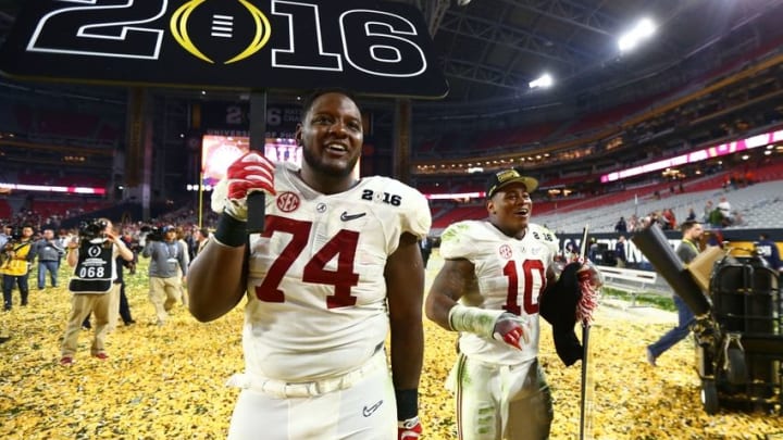 Jan 11, 2016; Glendale, AZ, USA; Alabama Crimson Tide offensive lineman Cam Robinson (74) and linebacker Reuben Foster (10) celebrate after defeating the Clemson Tigers in the 2016 CFP National Championship at University of Phoenix Stadium. Mandatory Credit: Mark J. Rebilas-USA TODAY Sports
