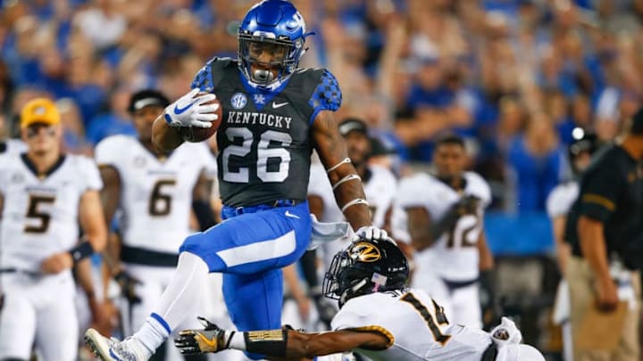 LEXINGTON, KY - OCTOBER 07: Benny Snell Jr. #26 of the Kentucky Wildcats runs for a seventy-one yard touchdown as Adam Sparks #14 of the Missouri Tigers reaches and misses the tackle at Commonwealth Stadium on October 7, 2017 in Lexington, Kentucky. (Photo by Michael Hickey/Getty Images)