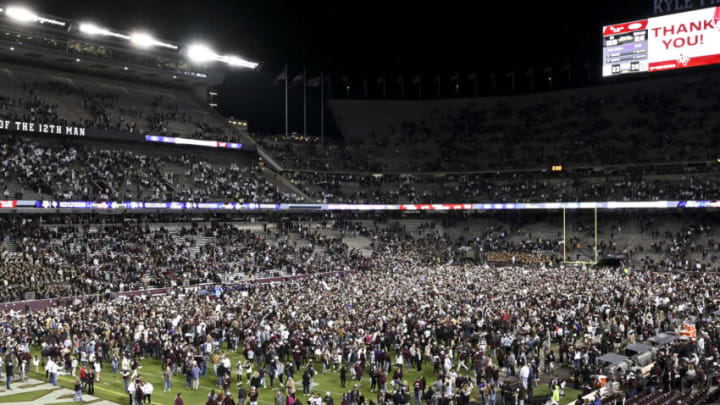 Nov 26, 2022; College Station, Texas, USA; Fans rush the field after the Texas A&M Aggies defeat the LSU Tigers at Kyle Field. Mandatory Credit: Maria Lysaker-USA TODAY Sports