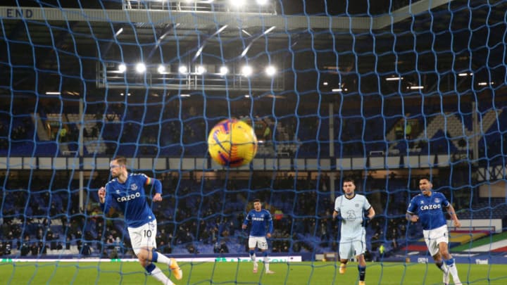 LIVERPOOL, ENGLAND - DECEMBER 12: Gylfi Sigurdsson of Everton (L) celebrates after scoring their team's first goal from the penalty spot during the Premier League match between Everton and Chelsea at Goodison Park on December 12, 2020 in Liverpool, England. A limited number of spectators (2000) are welcomed back to stadiums to watch elite football across England. This was following easing of restrictions on spectators in tiers one and two areas only. (Photo by Clive Brunskill/Getty Images)
