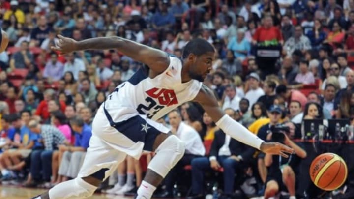 Aug 1, 2014; Las Vegas, NV, USA; USA Team White guard Kyrie Irving (23) chases a loose ball during the USA Basketball Showcase at Thomas & Mack Center. Mandatory Credit: Stephen R. Sylvanie-USA TODAY Sports