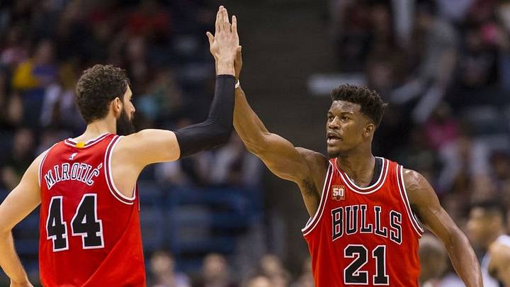 Apr 3, 2016; Milwaukee, WI, USA; Chicago Bulls guard Jimmy Butler (21) celebrates with forward Nikola Mirotic (44) during the fourth quarter against the Milwaukee Bucks at BMO Harris Bradley Center. Chicago won 102-98. Mandatory Credit: Jeff Hanisch-USA TODAY Sports