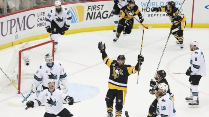 May 30, 2016; Pittsburgh, PA, USA; Pittsburgh Penguins center Nick Bonino (13) celebrates after scoring the game-winning goal against the San Jose Sharks in the third period game one of the 2016 Stanley Cup Final at Consol Energy Center. Mandatory Credit: Charles LeClaire-USA TODAY Sports