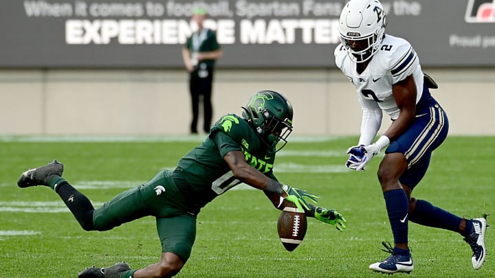 Sep 10, 2022; East Lansing, Michigan, USA; Michigan State Spartans cornerback Charles Brantley (0) breaks up a pass intended for Akron Zips running back Anthony Williams Jr. (2) in the third quarter. Mandatory Credit: Dale Young-USA TODAY Sports