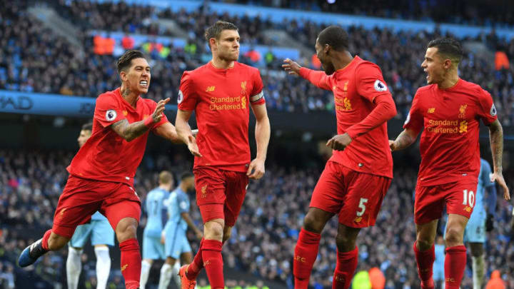 MANCHESTER, ENGLAND - MARCH 19: James Milner of Liverpool (C) celebrates scoring his sides first goal with his Liverpool team mates during the Premier League match between Manchester City and Liverpool at Etihad Stadium on March 19, 2017 in Manchester, England. (Photo by Laurence Griffiths/Getty Images)