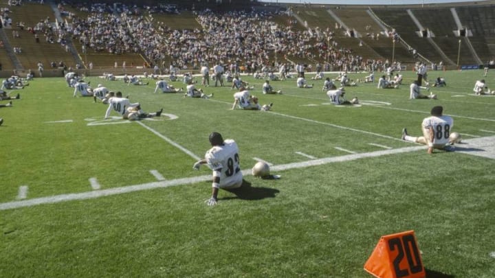 BERKELEY, CA - OCTOBER 12: Members of the Long Beach Poly High School football team warm up prior to a game against the Concord De La Salle Spartans played on October 12, 2002 in Memorial Stadium at the University of California at Berkeley, California. De La Salle won by a final score of 28-7, their 130th straight victory. (Photo by David Madison/Getty Images)