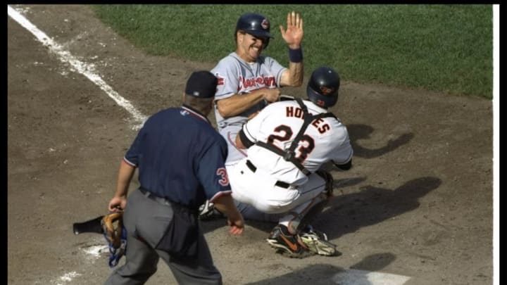 1 Oct 1996: Catcher Chris Hoiles of the Baltimore Orioles attempts to tag out Jeff Kent of the Cleveland Indians during a game at Camden Yards in Baltimore, Maryland. The Orioles won the game, 10-4. Mandatory Credit: Jed Jacobsohn /Allsport