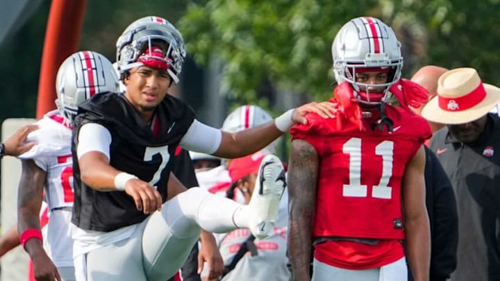 Aug 4, 2022; Columbus, OH, USA; Ohio State Buckeyes quarterback C.J. Stroud (7) stretches with wide receiver Jaxon Smith-Njigba (11) during the first fall football practice at the Woody Hayes Athletic Center. Mandatory Credit: Adam Cairns-The Columbus DispatchOhio State Football First Practice