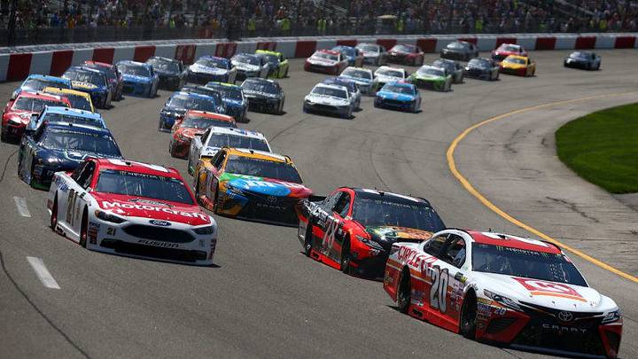RICHMOND, VA - APRIL 30: Matt Kenseth, driver of the #20 Circle K Toyota, and Ryan Blaney, driver of the #21 Motorcraft/Quick Lane Tire & Auto Center Ford, lead the field into turn one to start the Monster Energy NASCAR Cup Series Toyota Owners 400 at Richmond International Raceway on April 30, 2017 in Richmond, Virginia. (Photo by Sarah Crabill/Getty Images)
