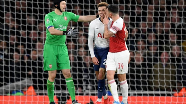 LONDON, ENGLAND - DECEMBER 19: Granit Xhaka of Arsenal clashes with Dele Alli of Tottenham Hotspur as Petr Cech of Arsenal attempts to calm the pair down during the Carabao Cup Quarter Final match between Arsenal and Tottenham Hotspur at Emirates Stadium on December 19, 2018 in London, United Kingdom. (Photo by Shaun Botterill/Getty Images)