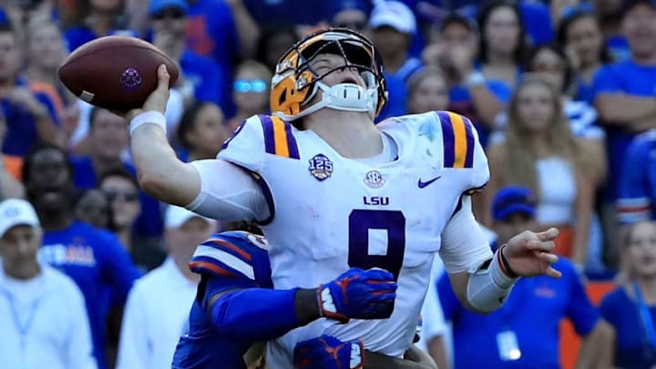GAINESVILLE, FL - OCTOBER 06: Joe Burrow #9 of the LSU Tigers is tackled by Jachai Polite #99 of the Florida Gators during the game at Ben Hill Griffin Stadium on October 6, 2018 in Gainesville, Florida. (Photo by Sam Greenwood/Getty Images)