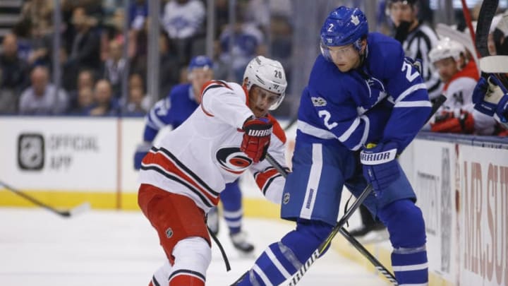 TORONTO, ON - OCTOBER 26: Toronto Maple Leafs defenseman Ron Hainsey (2) with a nifty backhand pass in front of Carolina Hurricanes right wing Sebastian Aho (20). Toronto Maple Leafs VS Carolina Panthers during 1st period action in NHL regular season play at the Air Canada Centre. Toronto Star/Rick Madonik (Rick Madonik/Toronto Star via Getty Images)