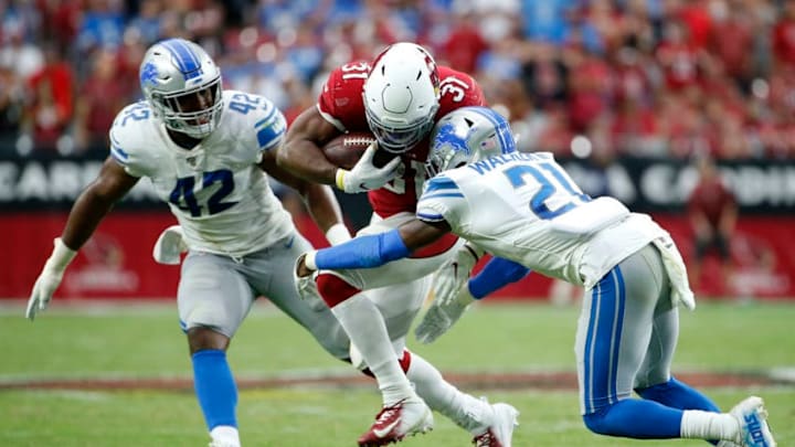 GLENDALE, ARIZONA - SEPTEMBER 08: Running back David Johnson #31 of the Arizona Cardinals is tackled by Tracy Walker #21 of the Detroit Lions as Devon Kennard #42 of the Lions trails the play during the second half of the NFL football game at State Farm Stadium on September 08, 2019 in Glendale, Arizona. The game ended with the Cardinals and Lions tied 27-27. (Photo by Ralph Freso/Getty Images)