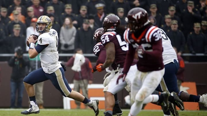 Oct 3, 2015; Blacksburg, VA, USA; Pittsburgh Panthers quarterback Nathan Peterman (4) rolls out to pass during the fourth quarter against the Virginia Tech Hokies at Lane Stadium. Mandatory Credit: Peter Casey-USA TODAY Sports
