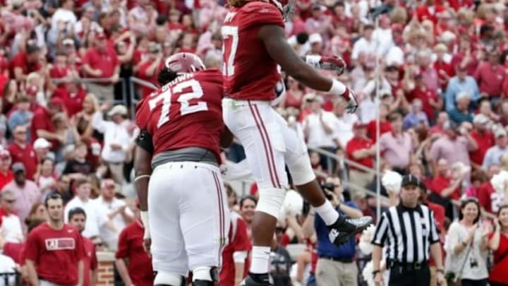 Oct 18, 2014; Tuscaloosa, AL, USA; Alabama Crimson Tide running back Derrick Henry (27) celebrates with offensive lineman Leon Brown (72) after Henry scored a touchdown against the Texas A&M Aggies at Bryant-Denny Stadium. Mandatory Credit: Marvin Gentry-USA TODAY Sports