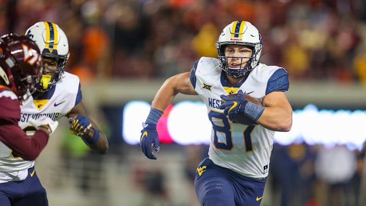 BLACKSBURG, VA – SEPTEMBER 22: Tight end Mike O’Laughlin #87 of the West Virginia Mountaineers runs the ball against the Virginia Tech Hokies during the college football game between the Virginia Tech Hokies and the West Virginia Mountaineers at Lane Stadium on September 22, 2022, in Blacksburg, Virginia. (Photo by Ryan Hunt/Getty Images)