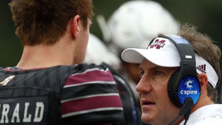 STARKVILLE, MS - NOVEMBER 4: Head coach Dan Mullen of the Mississippi State Bulldogs talks with Nick Fitzgerald