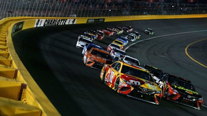 CHARLOTTE, NC - MAY 19: Kyle Busch, driver of the #18 M and M's Red Nose Day Toyota, and Martin Truex Jr., driver of the #78 5-hour Energy/Bass Pro Shops Toyota (Photo by Sean Gardner/Getty Images)