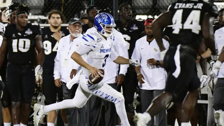 ORLANDO, FLORIDA - DECEMBER 01: Brady White #3 of the Memphis Tigers runs for a first down in the fourth quarter of the American Athletic Championship against the UCF Knights at Spectrum Stadium on December 01, 2018 in Orlando, Florida. (Photo by Julio Aguilar/Getty Images)