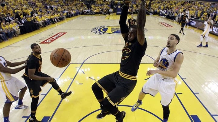 Jun 19, 2016; Oakland, CA, USA; Cleveland Cavaliers forward LeBron James (23) dunks the ball against Golden State Warriors guard Klay Thompson (11) in game seven of the NBA Finals at Oracle Arena. Mandatory Credit: Marcio Jose Sanchez-Pool Photo via USA TODAY Sports