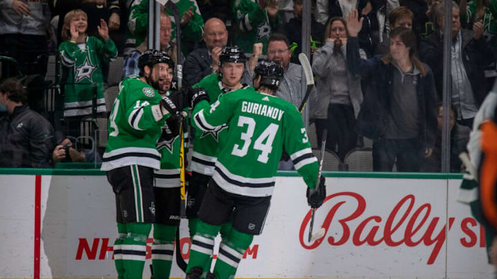 Dec 20, 2021; Dallas, Texas, USA; Dallas Stars left wing Jamie Benn (14) and center Tyler Seguin (91) and defenseman Thomas Harley (55) and right wing Denis Gurianov (34) celebrate a goal scored by Seguin against the Minnesota Wild during the first period at the American Airlines Center. Mandatory Credit: Jerome Miron-USA TODAY Sports