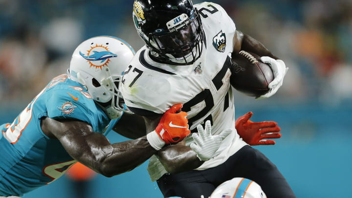 MIAMI, FLORIDA – AUGUST 22: Leonard Fournette #27 of the Jacksonville Jaguars runs with the ball against the Miami Dolphins during the first quarter of the preseason game at Hard Rock Stadium on August 22, 2019 in Miami, Florida. (Photo by Michael Reaves/Getty Images)