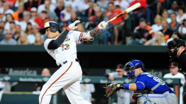 May 20, 2017; Baltimore, MD, USA; Baltimore Orioles third baseman Manny Machado (13) singles in the first inning against the Toronto Blue Jays at Oriole Park at Camden Yards. Mandatory Credit: Evan Habeeb-USA TODAY Sports