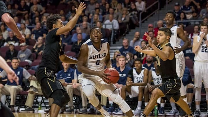 Nov 24, 2016; Las Vegas, NV, USA; Butler Bulldogs guard Avery Woodson (0) goes betweenVanderbilt Commodores guard Payton Willis (1) and Vanderbilt Commodores guard Nolan Cressler (24) during the second half at Orleans Arena. Butler won 76-66. Mandatory Credit: Joshua Dahl-USA TODAY Sports