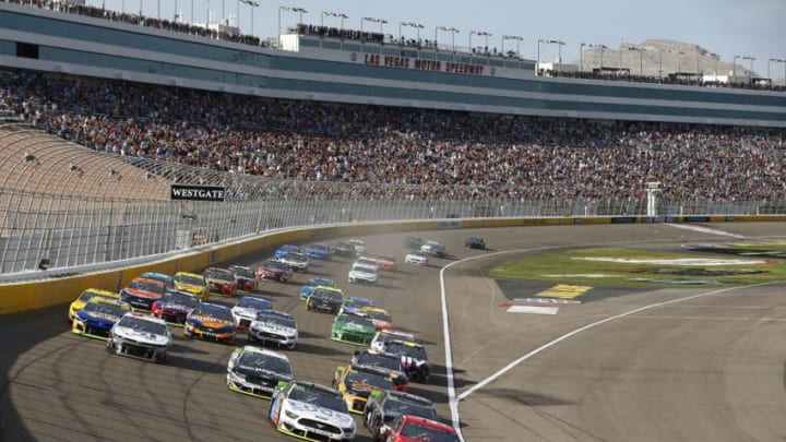 LAS VEGAS, NEVADA - SEPTEMBER 15: Clint Bowyer, driver of the #14 Toco Warranty Ford, and Daniel Suarez, driver of the #41 Haas Automation Ford, lead the field to start the Monster Energy NASCAR Cup Series South Point 400 at Las Vegas Motor Speedway on September 15, 2019 in Las Vegas, Nevada. (Photo by Jonathan Ferrey/Getty Images)