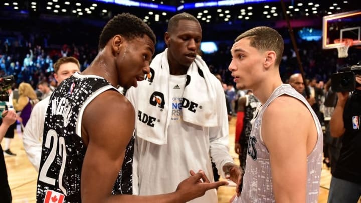 Feb 13, 2015; New York, NY, USA; World Team guard Andrew Wiggins of the Minnesota Timberwolves (22) talks to World Team center Gorgui Dieng of the Minnesota Timberwolves (5, center) and U.S. Team guard Zach LaVine of the Minnesota Timberwolves (8, right) after the game at Barclays Center. Mandatory Credit: Bob Donnan-USA TODAY Sports