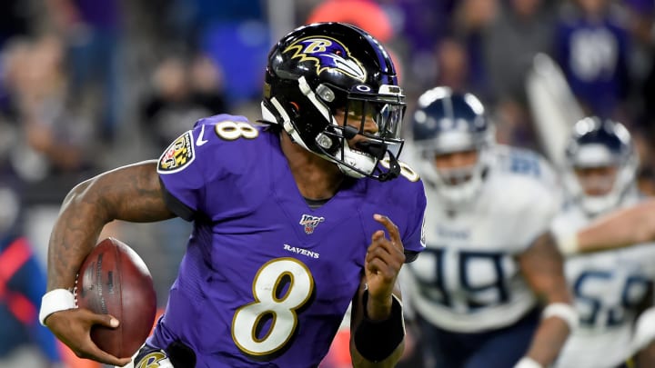 BALTIMORE, MARYLAND – JANUARY 11: Lamar Jackson #8 of the Baltimore Ravens runs against the Tennessee Titans during the AFC Divisional Playoff game at M&T Bank Stadium on January 11, 2020 in Baltimore, Maryland. (Photo by Will Newton/Getty Images)