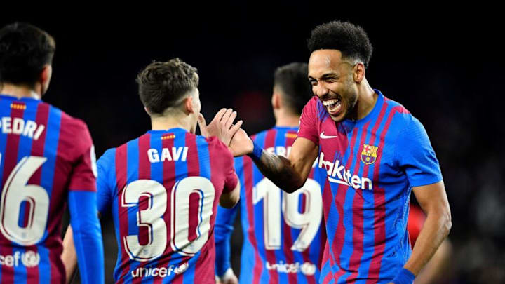 Pierre-Emerick Aubameyang (R) celebrates with Gavi after scoring his team's first goal during the Spanish league football match between FC Barcelona and Athletic Club Bilbao at the Camp Nou stadium in Barcelona on February 27, 2022. (Photo by PAU BARRENA/AFP via Getty Images)