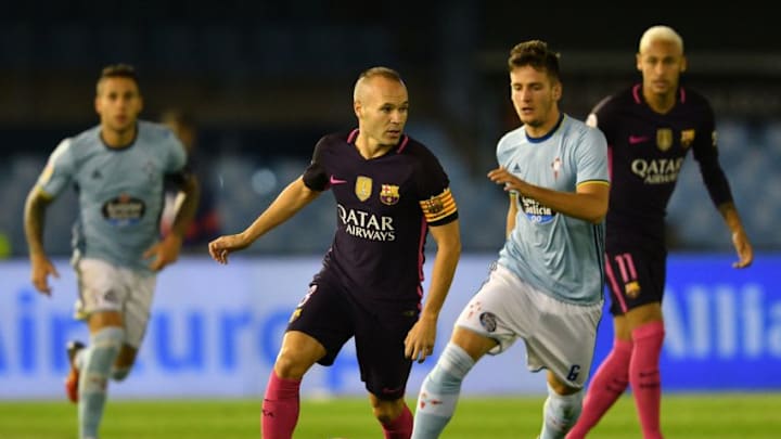 VIGO, SPAIN - OCTOBER 02: Radoja of RC Celta de Vigo competes for the ball with Andrés Iniesta of FC Barcelona during the La Liga match between Real Club Celta de Vigo and Futbol Club Barcelona at the Balaidos stadium on October 02, 2016 in Vigo, Spain. (Photo by Octavio Passos/Getty Images)