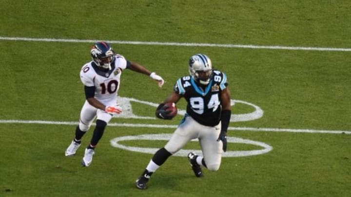 Feb 7, 2016; Santa Clara, CA, USA; Carolina Panthers defensive end Kony Ealy (94) returns an interception with Denver Broncos wide receiver Emmanuel Sanders (10) chasing in Super Bowl 50 at Levi