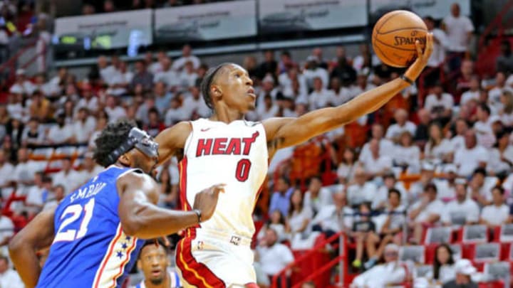 The Miami Heat’s Josh Richardson leaps past the Philadelphia 76ers’ Joel Embiid (21) for a basket in the first quarter in Game 4 of the first-round NBA Playoff series at the AmericaneAirlines Arena in Miami on Saturday, April 21, 2018. (Charles Trainor Jr./Miami Herald/TNS via Getty Images)