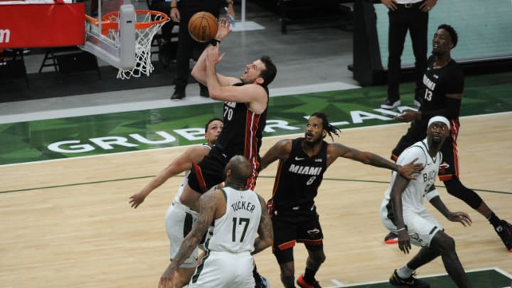 Miami Heat forward Nemanja Bjelica (70) is fouled by Milwaukee Bucks forward P.J. Tucker (17)(Michael McLoone-USA TODAY Sports)