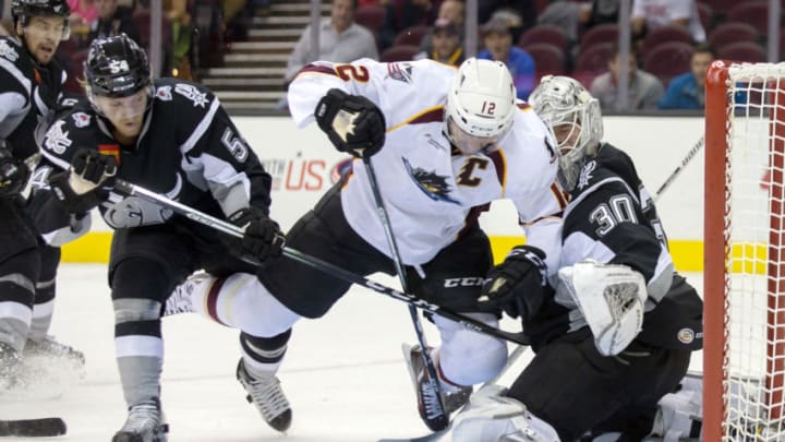 CLEVELAND, OH - October 27: A collision with San Antonio Rampage D Anton Lindholm (54) sends Cleveland Monsters LW Ryan Craig (12) into San Antonio Rampage G Spencer Martin (30) during the second period of the AHL hockey game between the San Antonio Rampage and Cleveland Monsters on October 27, 2016, at Quicken Loans Arena in Cleveland, OH. San Antonio defeated Cleveland 4-2. (Photo by Frank Jansky/Icon Sportswire via Getty Images)