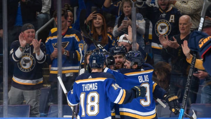 ST. LOUIS, MO - OCTOBER 11: Joel Edmundson #6 of the St. Louis Blues is congratulated by teammates after scoring a goal against the Calgary Flames at Enterprise Center on October 11, 2018 in St. Louis, Missouri. (Photo by Scott Rovak/NHLI via Getty Images)