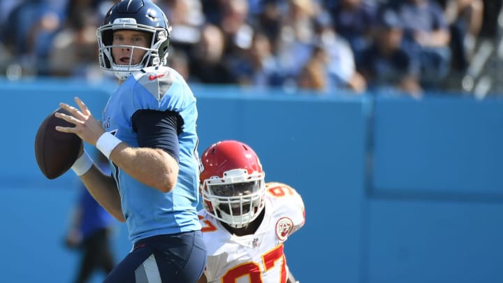 Oct 24, 2021; Nashville, Tennessee, USA; Tennessee Titans quarterback Ryan Tannehill (17) throws before pressure from Kansas City Chiefs defensive end Alex Okafor (97) during the first half at Nissan Stadium. Mandatory Credit: Christopher Hanewinckel-USA TODAY Sports