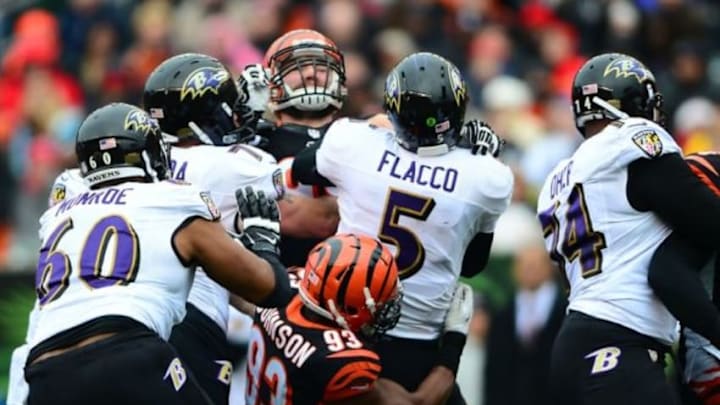 Dec 29, 2013; Cincinnati, OH, USA; Cincinnati Bengals defensive end Michael Johnson (93) sacks Baltimore Ravens quarterback Joe Flacco (5) during the second quarter at Paul Brown Stadium. Mandatory Credit: Andrew Weber-USA TODAY Sports