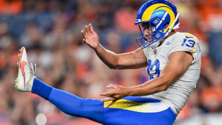 DENVER, COLORADO – AUGUST 28: Corey Bojorquez #13 of the Los Angeles Rams punts against the Denver Broncos during an NFL preseason game at Empower Field at Mile High on August 28, 2021 in Denver, Colorado. (Photo by Dustin Bradford/Getty Images)