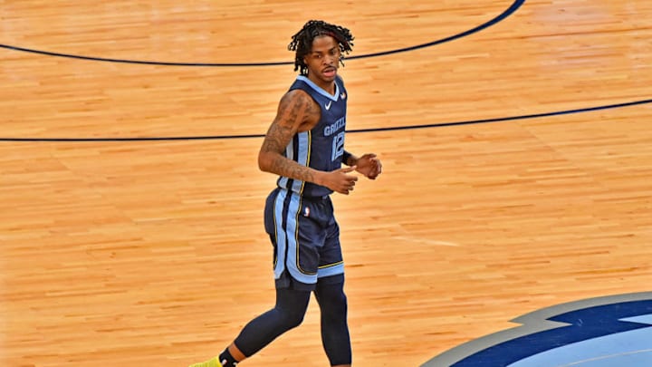 MEMPHIS, TENNESSEE - FEBRUARY 10: Ja Morant #12 of the Memphis Grizzlies looks on during the game against the Charlotte Hornets at FedExForum on February 10, 2021 in Memphis, Tennessee.NOTE TO USER: User expressly acknowledges and agrees that, by downloading and or using this photograph, User is consenting to the terms and conditions of the Getty Images License Agreement. (Photo by Justin Ford/Getty Images)
