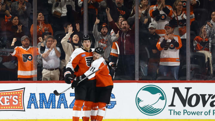 PHILADELPHIA, PENNSYLVANIA - OCTOBER 26: Travis Sanheim #6 and Travis Konecny #11 of the Philadelphia Flyers react following a goal by Sanheim during the third period against the Minnesota Wild at Wells Fargo Center on October 26, 2023 in Philadelphia, Pennsylvania. (Photo by Tim Nwachukwu/Getty Images)