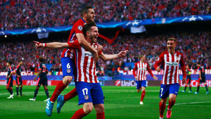 MADRID, SPAIN - APRIL 27: Saul Niguez of Atletico Madrid (17) celebrates with Koke of Atletico Madrid and team mates as he scores their first goal during the UEFA Champions League semi final first leg match between Club Atletico de Madrid and FC Bayern Muenchen at Vincente Calderon on April 27, 2016 in Madrid, Spain. (Photo by Gonzalo Arroyo Moreno/Getty Images)