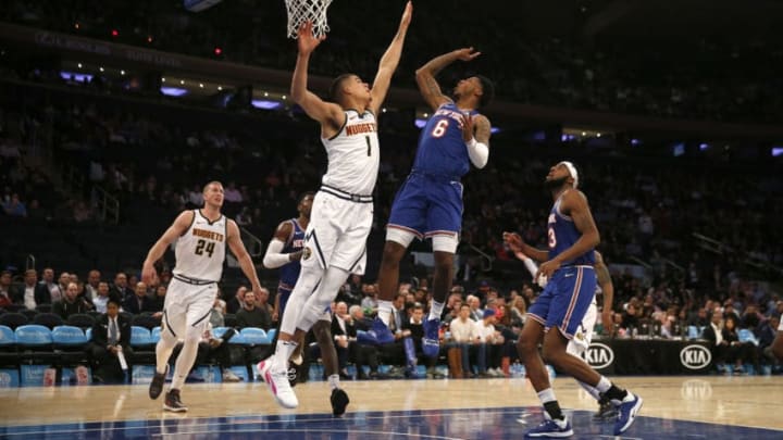 NEW YORK, NEW YORK - DECEMBER 05: Michael Porter Jr. #1 of the Denver Nuggets tries to block a shot from Elfrid Payton #6 of the New York Knicks in the fourth quarter at Madison Square Garden on December 05, 2019 in New York City. NOTE TO USER: User expressly acknowledges and agrees that, by downloading and or using this photograph, User is consenting to the terms and conditions of the Getty Images License Agreement. (Photo by Elsa/Getty Images)