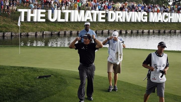 Sep 9, 2012; Carmel, IN, USA; Phil Mickelson and Vijay Singh walks off the 18th green during the BMW Championship at Crooked Stick Golf Club. Mandatory Credit: Brian Spurlock-USA TODAY Sports